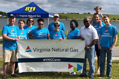 People holding Virginia Natural Gas sign