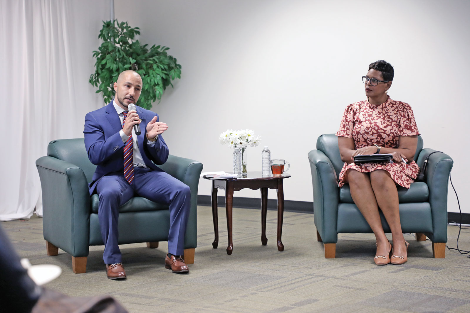 Author John H. Davis and VPCC President Dr. Towuanna Porter Brannon discuss challenges military personnel face when transitioning to college.
