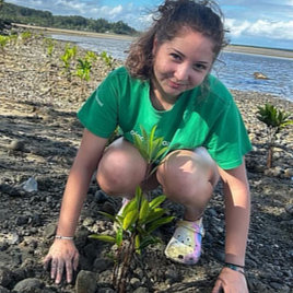 Anna Chavez’s conservation efforts on a recent trip to Fiji involved planting mangrove seedlings.