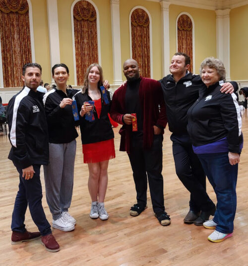 Pictured at the Bam Jam competition in Maryland are (l-r) ballroom dance team Coach Riccardo Paccini, Kaitlyn McFadden, Lawren Speight, Assistant Coach Faizon Alexander, Trevor Herring, and Coach/Advisor Pam Roberts