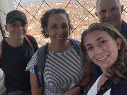 The Ragno Family: Kerry Ragno (second from left) her husband, Rich, and their children, Will and Maeve, enjoy traveling. This picture was taken at the top of a tower in Venice, Italy, last summer. (Photo courtesy of Kerry Ragno)