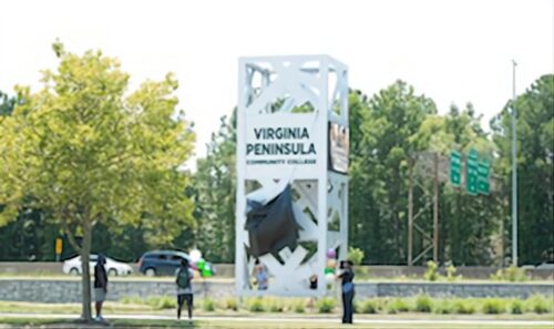The unveiling of the new VPCC sign at the Hampton campus overlooking Interstate 64