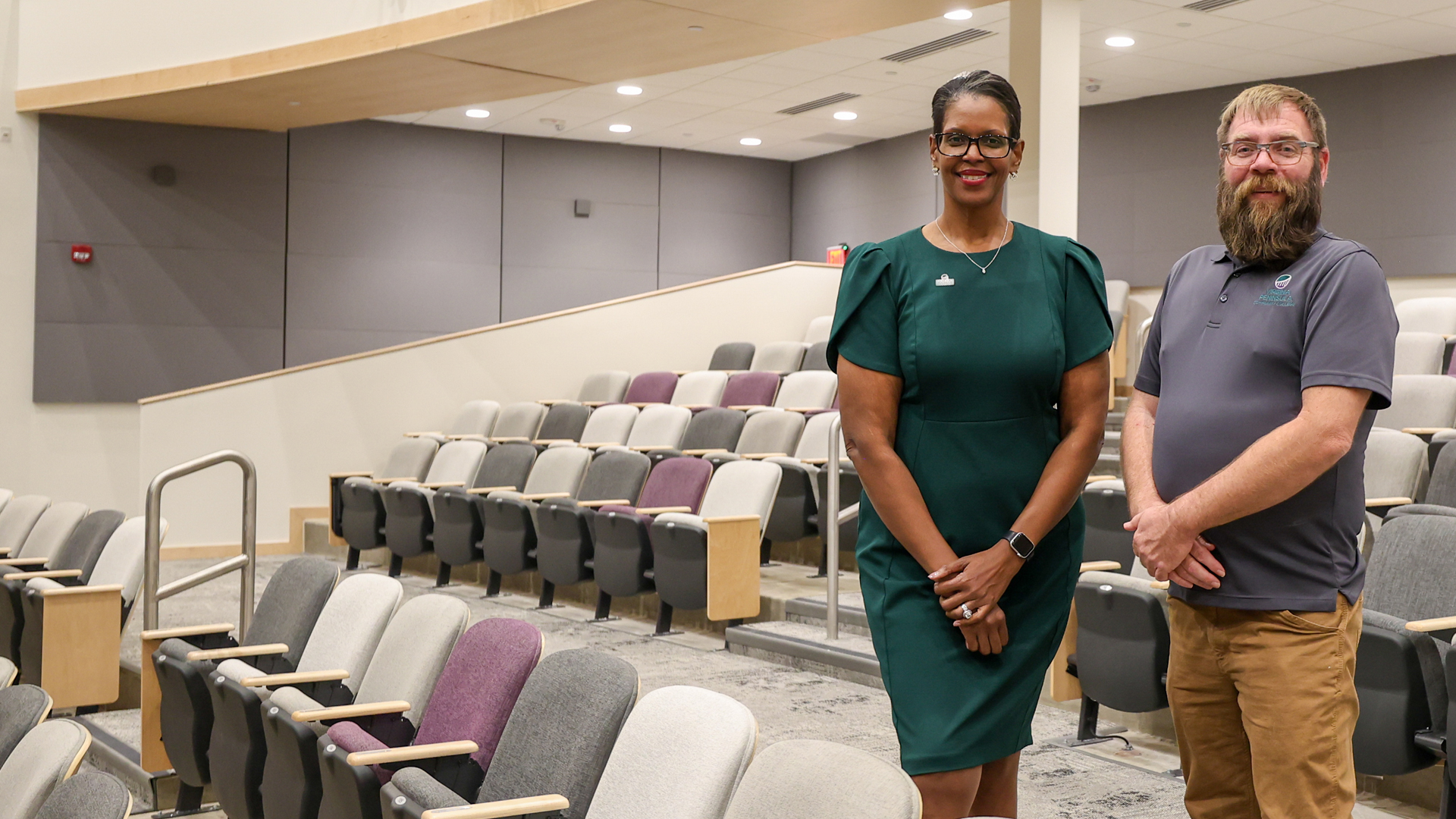 VPCC President Dr. Towuanna Porter Brannon and Theater Manager David Garrett are shown inside the rebuilt theater.