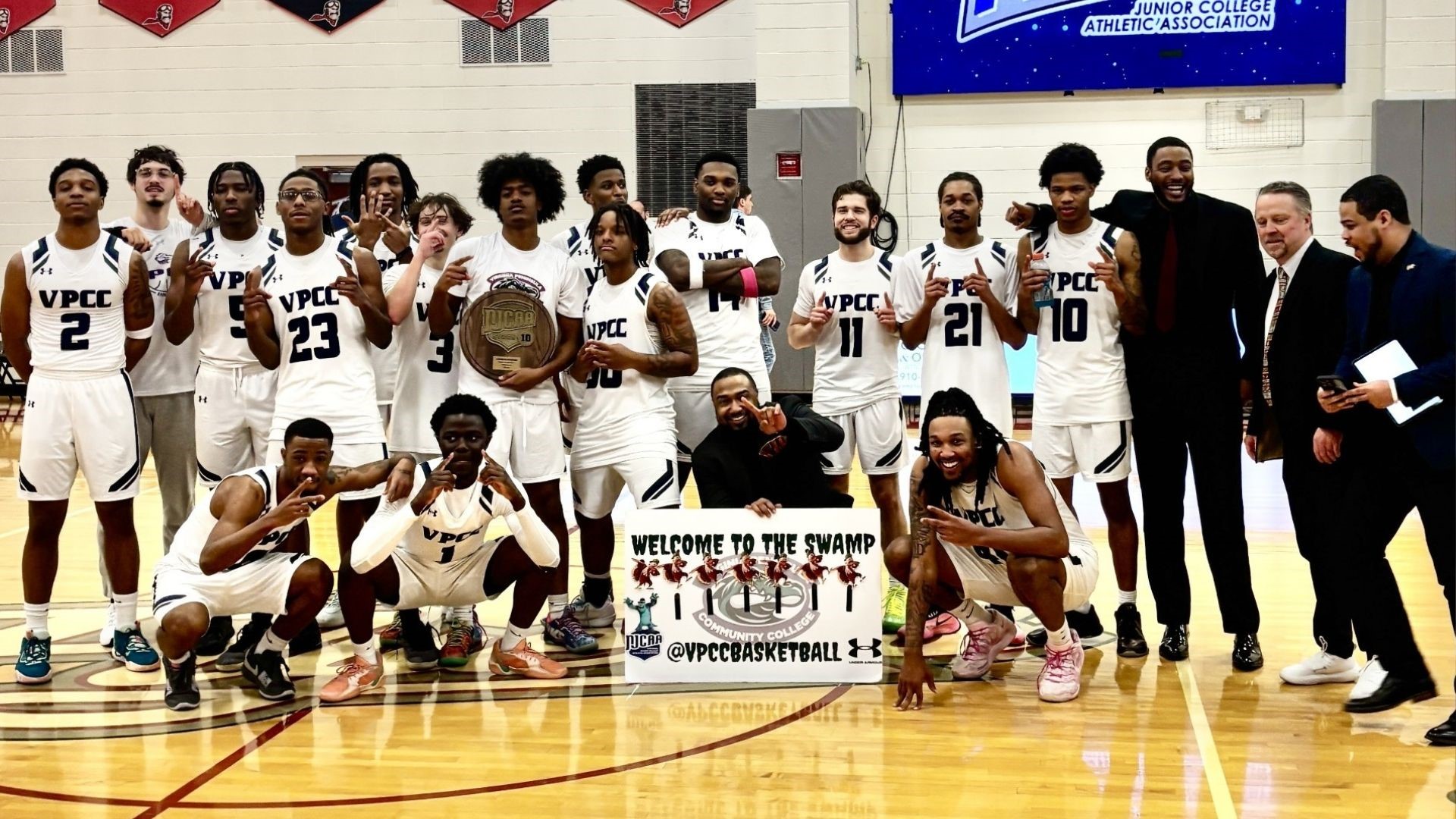 Gators players and coaches celebrate after Sunday's historic win.