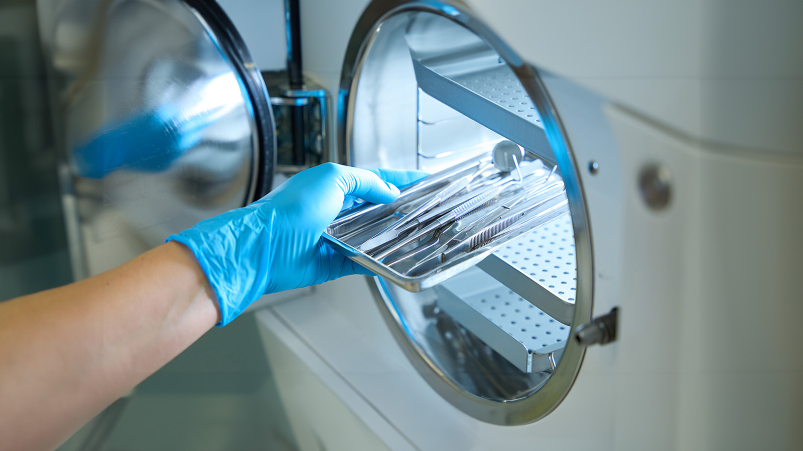 A technician using a sterilizing machine