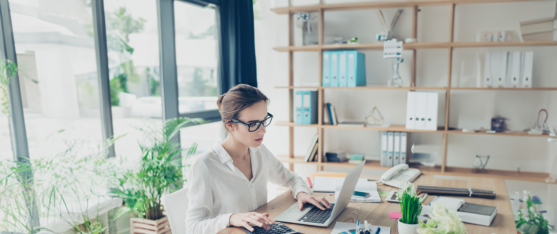 An accountant working on a computer