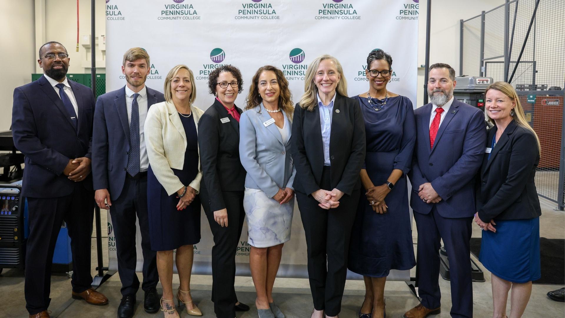 Gov. Abigail Spanberger (fourth from right) was joined by a host of VPCC officials at Wednesday’s bill signing. The VPCC representatives were (from left) Bobby Perkins (Director of Manufacturing, Skilled Trades and Transportation), Steven Felker (VP for Institutional Effectiveness and Transformation), Barbara Mason (Executive Assistant and Project Manager), Dr. Kerry Ragno (VP for Academic Affairs), Daniela Cigularov (VP for Enrollment Management and Student Success), Dr. Porter Brannon (President), Todd Estes (VP for Workforce Development and Innovation), and Ada Badgley (Chief of Staff and Director of Strategic Initiatives).