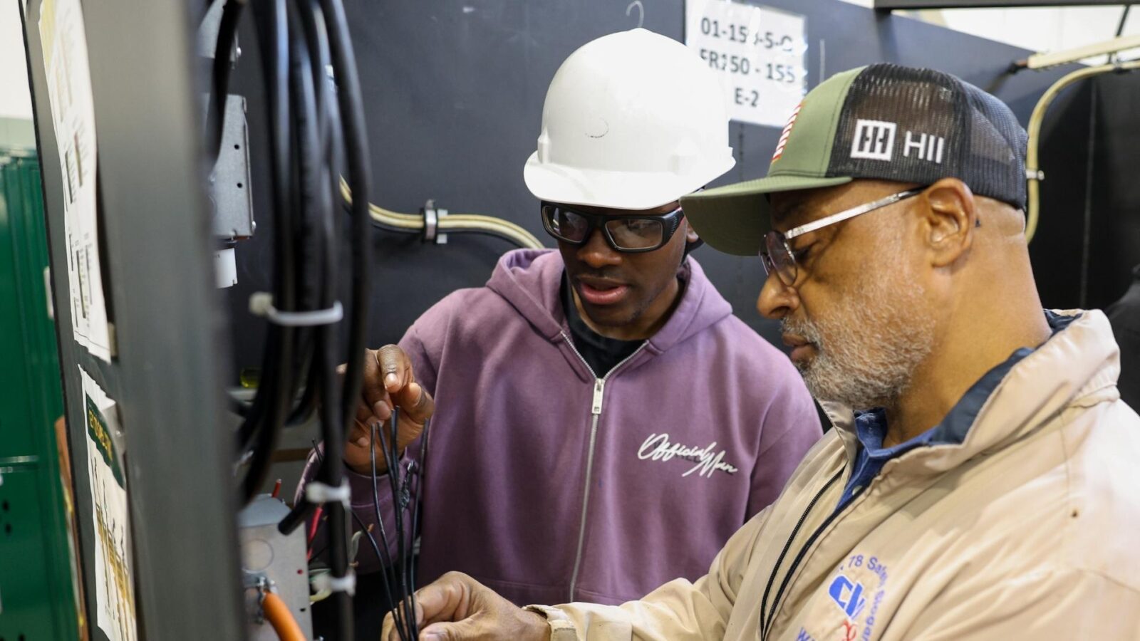 Instructor Kenneth Logan (right) works with a student in his MTT electrician class at VPCC's Newport News Trades Center.
