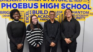 Multiethnic group of four people standing in front of a colorful wall
