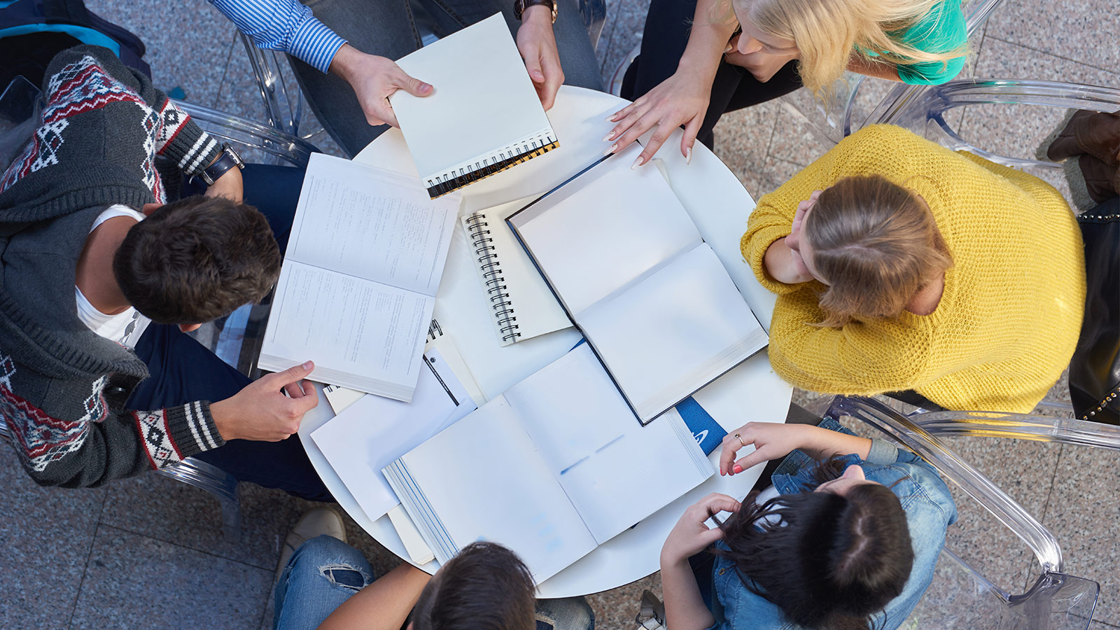 Students studying around an outdoor table