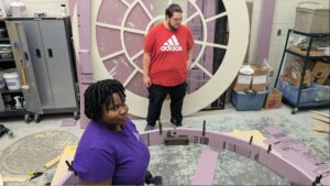 Kynnidi Piert (front) and Max Ikehara were among the VPCC students who worked on scenery for the VA250 July 4 event.